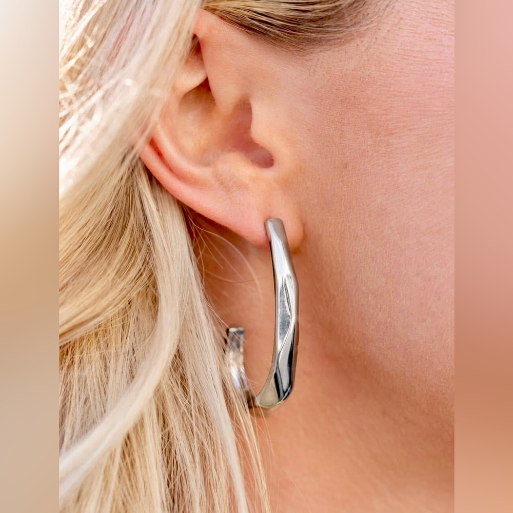 Shiny silver J shaped hoop earrings